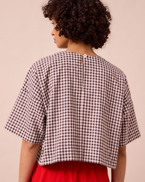 model wears lisa ganache gingham cotton linen top