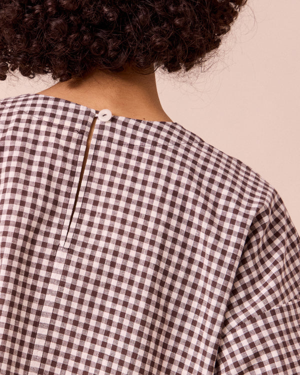 model wears lisa ganache gingham cotton linen top
