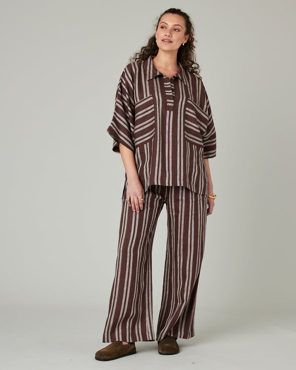 pregnant model wears coconut stripe linen lexi trousers