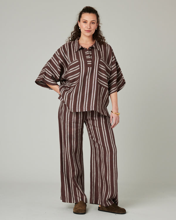 pregnant model wears coconut stripe linen lexi trousers