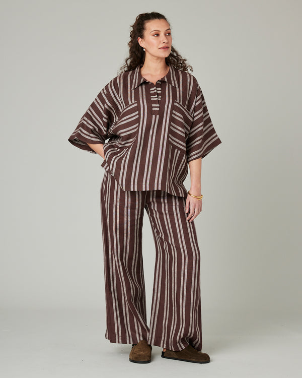 pregnant model wears coconut stripe linen lexi trousers