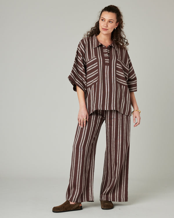 pregnant model wears coconut stripe linen lexi trousers