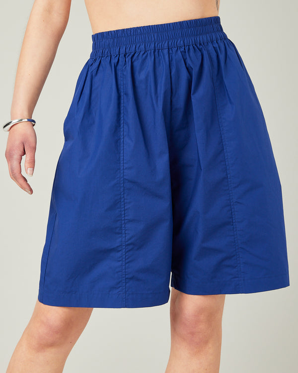 model wears cobalt liv poplin shorts
