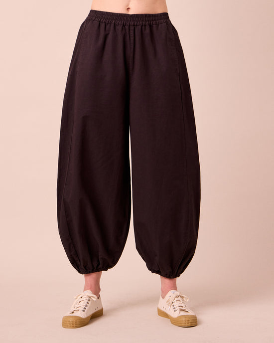 model wears logan cotton linen slub trousers front