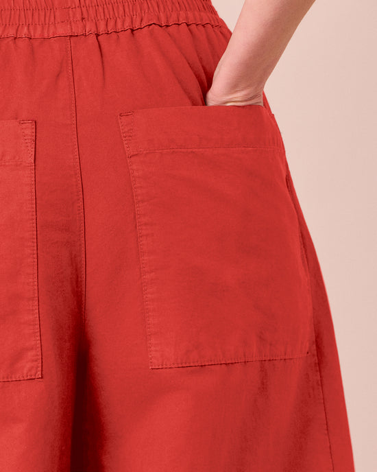 model wears logan brick cotton trousers 