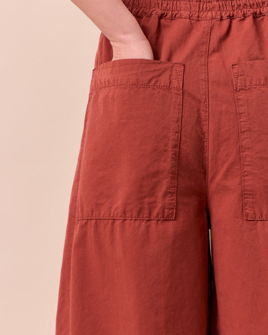model wears logan brick cotton linen slub trousers 