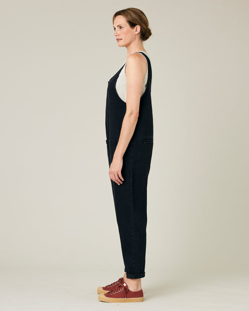 model wears black lola denim jumpsuit