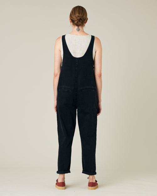 model wears black lola denim jumpsuit