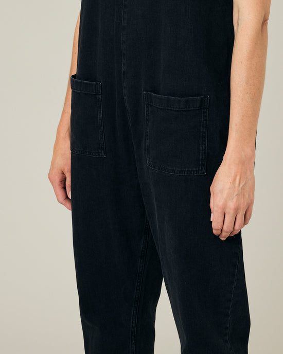 model wears black lola denim jumpsuit