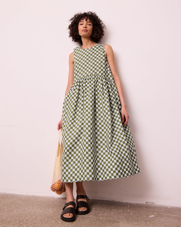 model wears dakota sky blue check linen dress