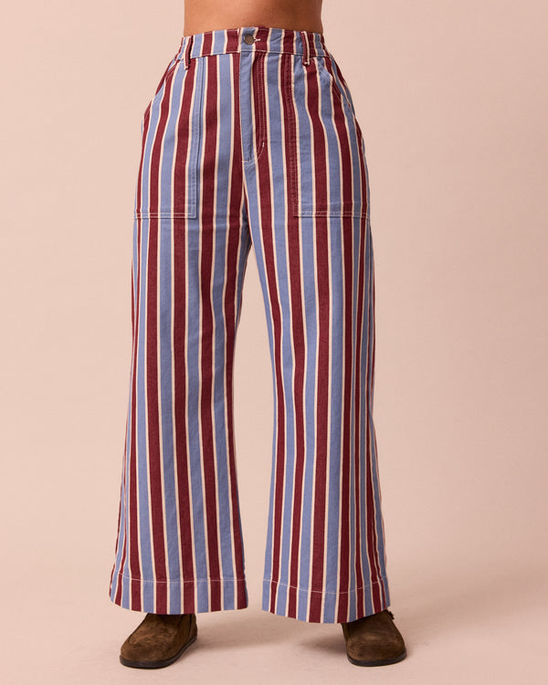 model wears luca burgundy and sky stripe denim trousers front