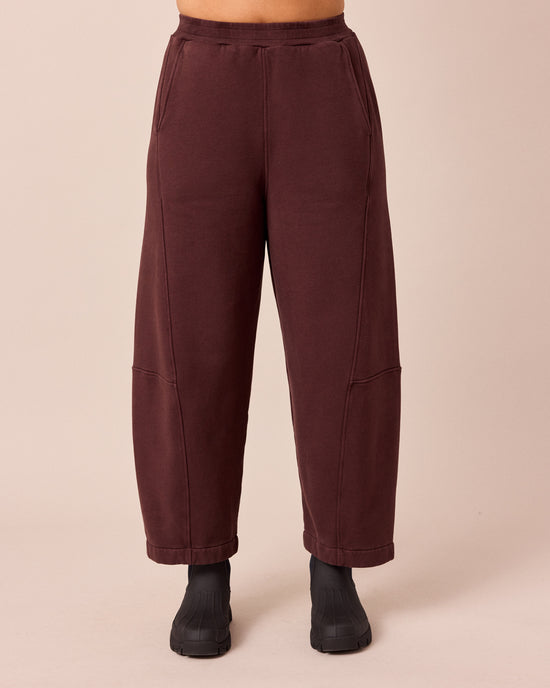 model wears lyra black cherry fleeceback jersey trousers front
