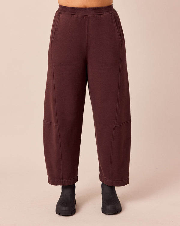 model wears lyra black cherry fleeceback jersey trousers front