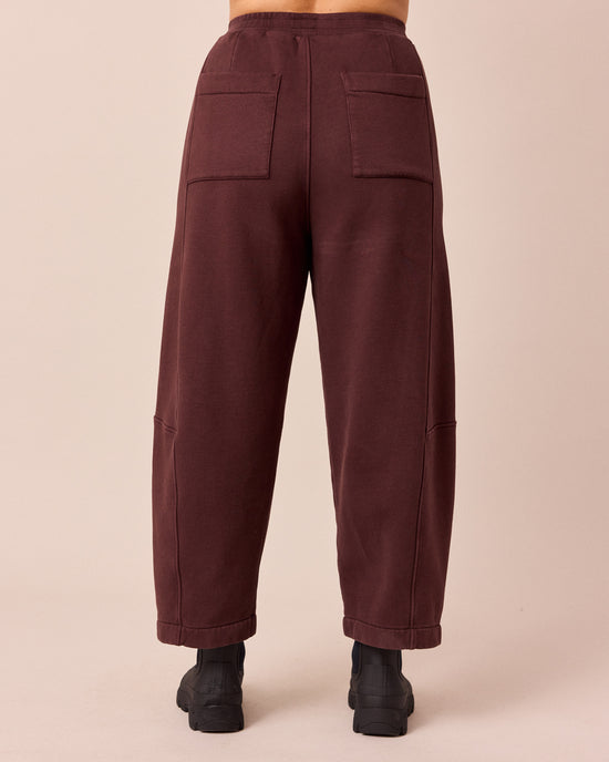 model wears lyra black cherry fleeceback jersey trousers back