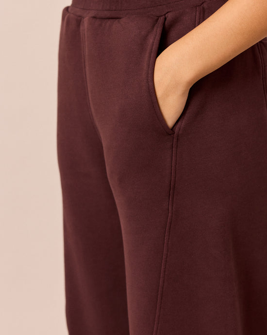 model wears lyra black cherry fleeceback jersey trousers