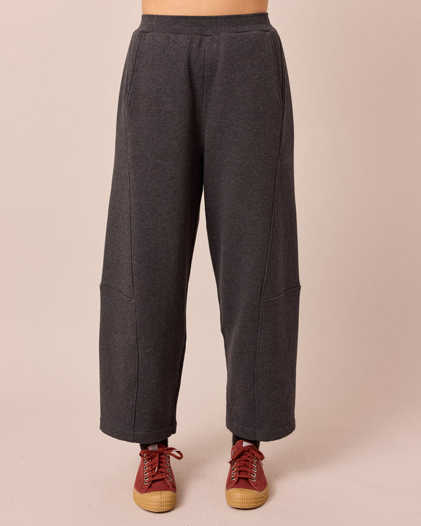 model wears lyra charcal fleeceback jersey trousers front