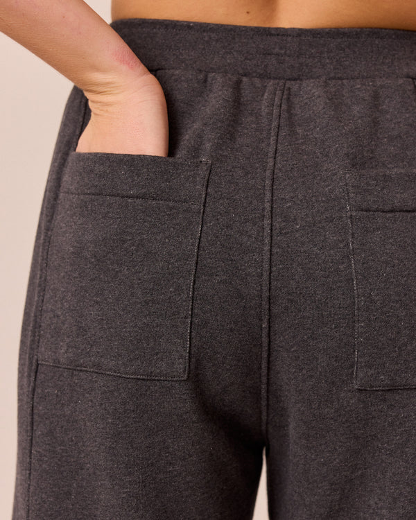 model wears lyra charcal fleeceback jersey trousers