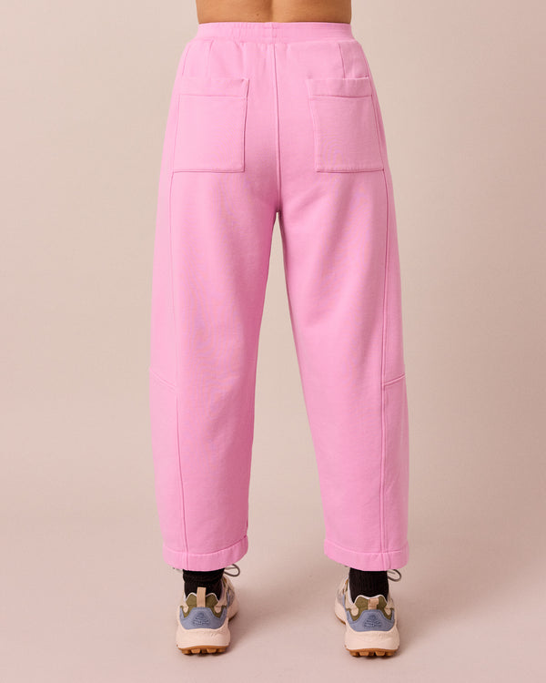 model wears lyra washed pink jersey trousers back