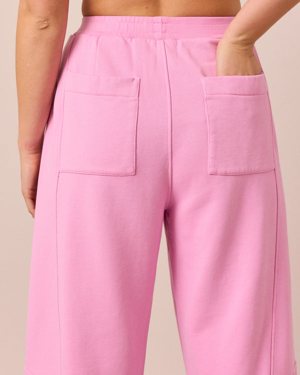 model wears lyra washed pink jersey trousers