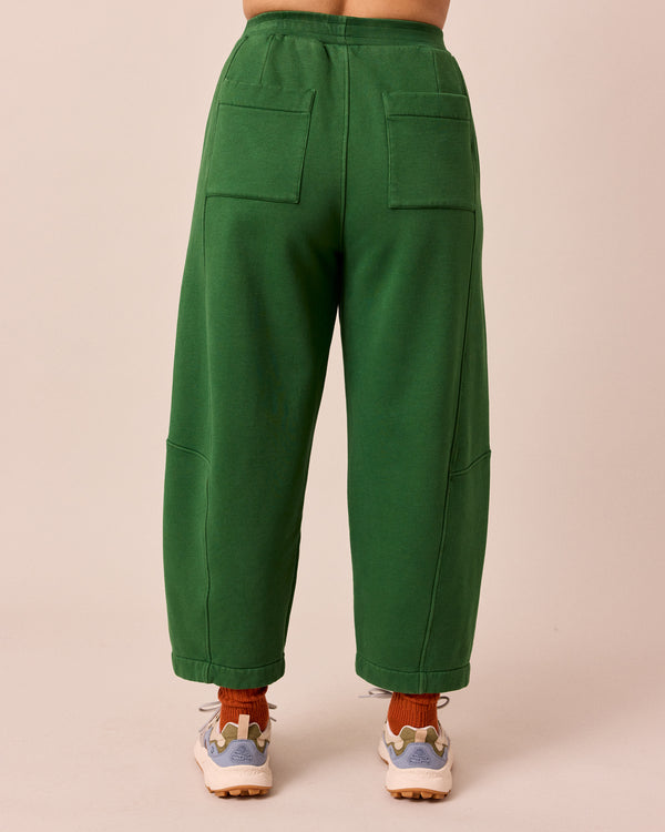 model wears lyra verdant green fleeceback jersey trousers back