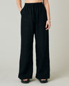 model wears black linen lexi trousers front