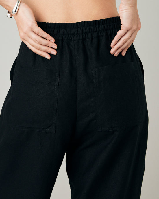 model wears black linen lexi trousers