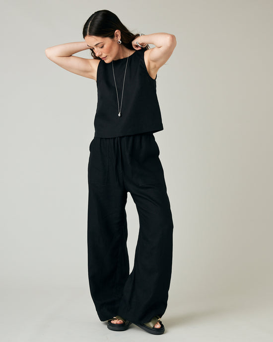 model wears black linen lexi trousers