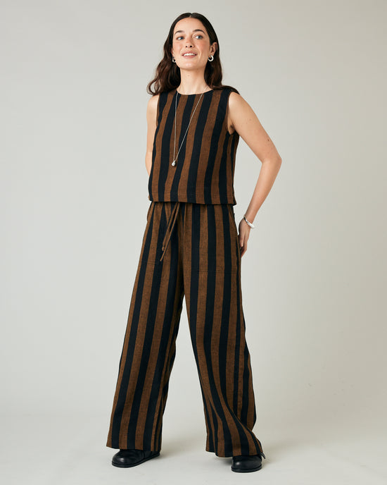 model wears rust stripe lexi linen trousers