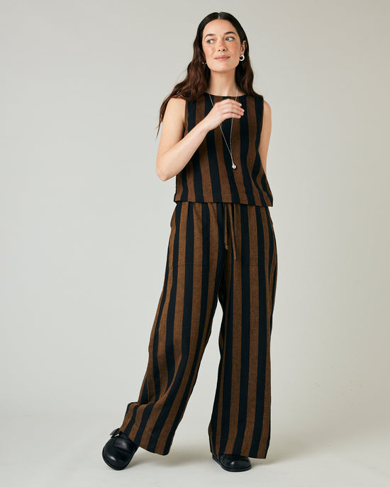 model wears rust stripe lexi linen trousers