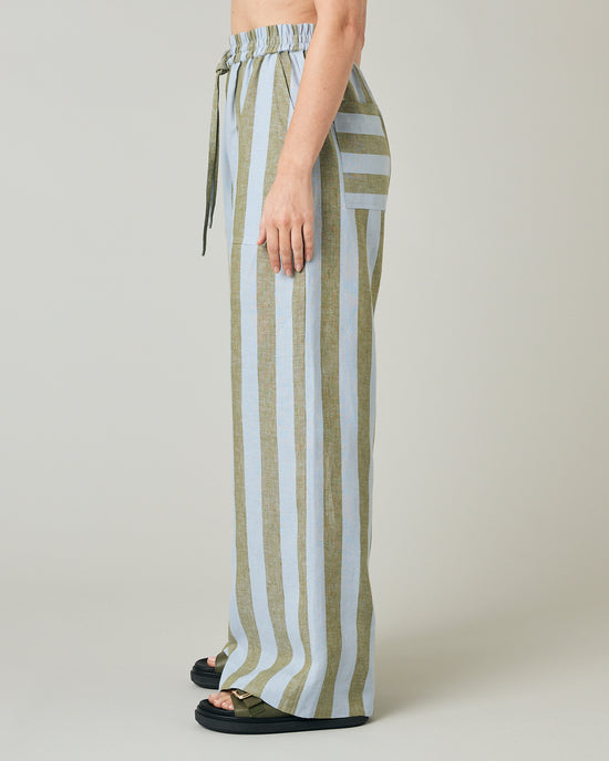 model wears meadow stripe lexi linen trousers left