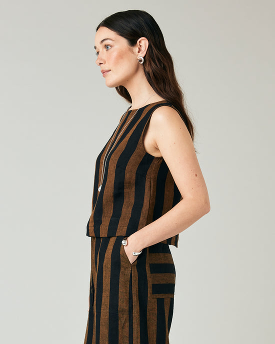 model wears esme linen rust stripe top