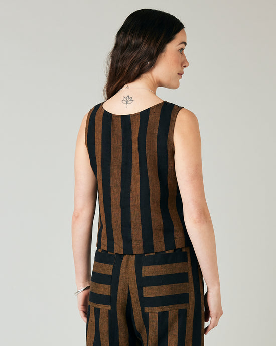 model wears esme linen rust stripe top