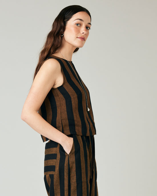 model wears esme linen rust stripe top