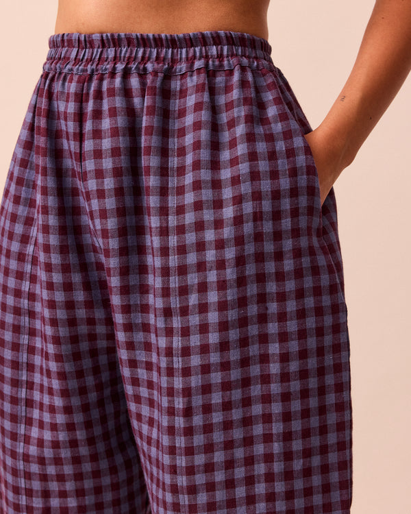 model wears mabel blueberry gingham linen trousers 