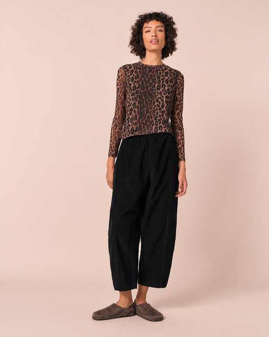 model wears mabel black cord trousers right