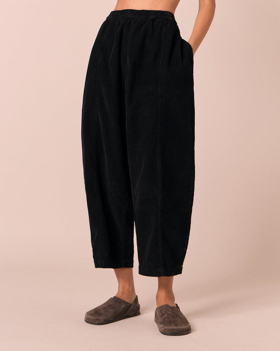 model wears mabel black cord trousers front