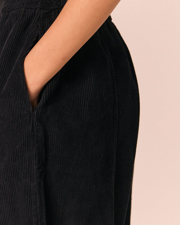model wears mabel black cord trousers 