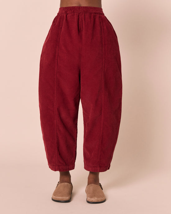 model wears mabel garnet cord trousers front