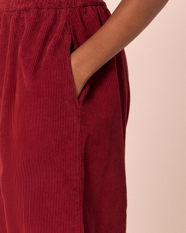 model wears mabel garnet cord trousers 