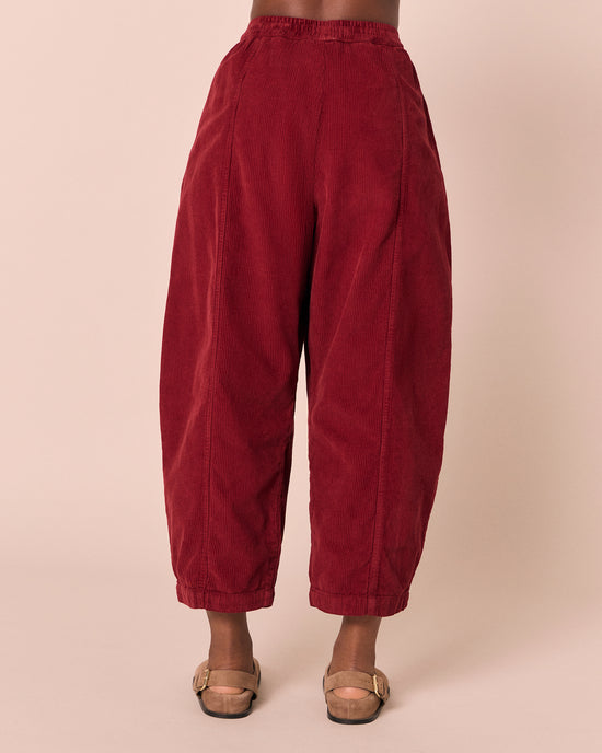 model wears mabel garnet cord trousers back