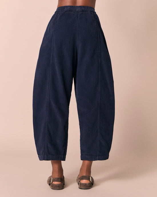model wears mabel navy cord trousers back