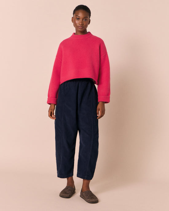 model wears mabel navy cord trousers left