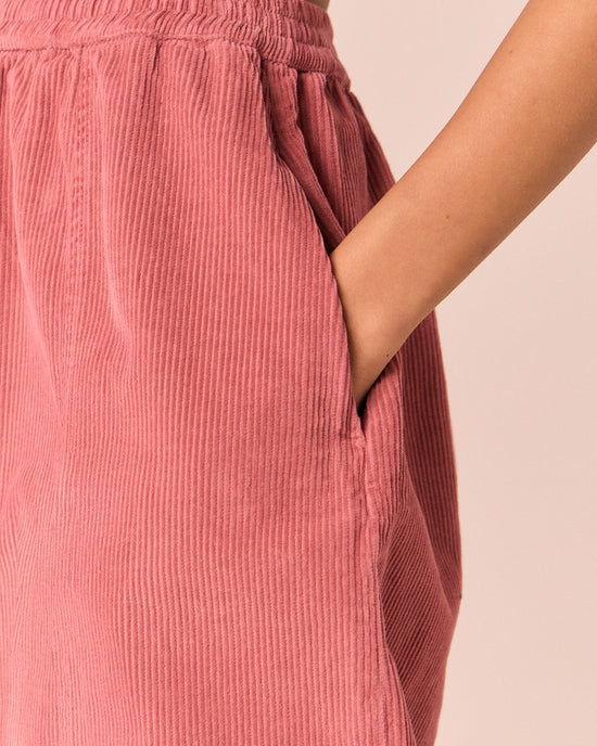model wears mael parfait pink cord trousers