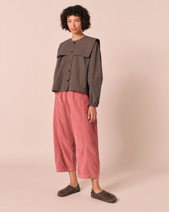 model wears mabel parfait pink cord trousers right