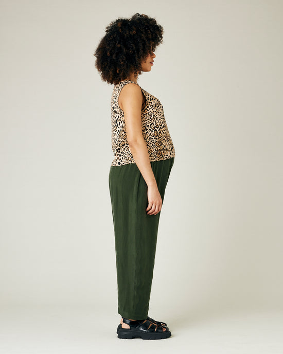 pregnant model wears dark khaki cupro mabel trousers