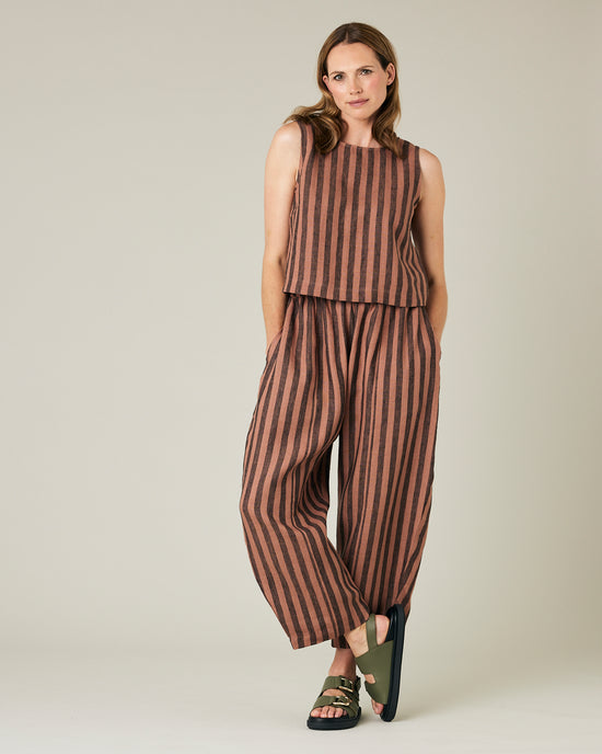 model wears longer length biscuit stripe mabel trousers