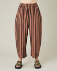 model wears longer length biscuit stripe mabel trousers front