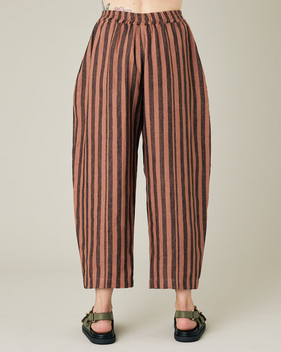 model wears longer length biscuit stripe mabel trousers back