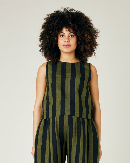 pregnant model wears olive and black stripe linen esme top