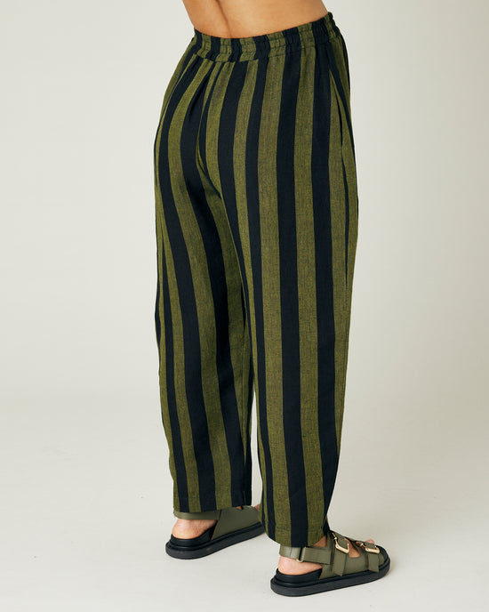 pregnant model wears olive and black stripe linen mabel trousers